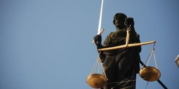 Statue of a lady holding a sword