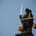Statue of a lady holding a sword