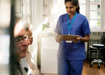 A nurse and some elderly patients