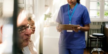 A nurse and some elderly patients