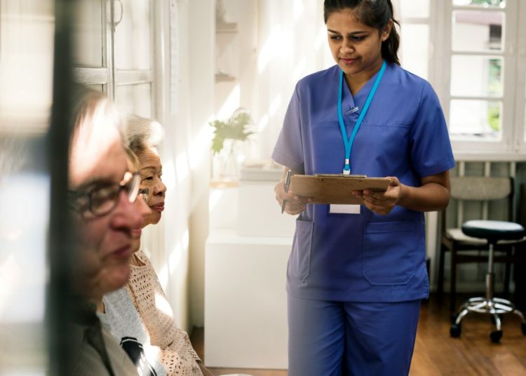 A nurse and some elderly patients