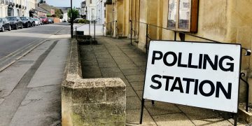 Polling station sign on a street