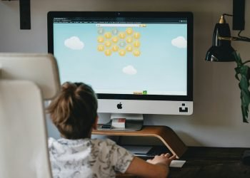 child playing game on computer screen