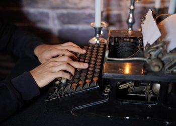 Person using a typewriter