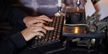 Person using a typewriter