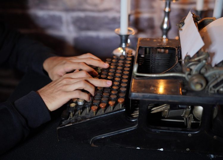 Person using a typewriter