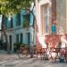 A table and chairs and a bike in a village in Spain