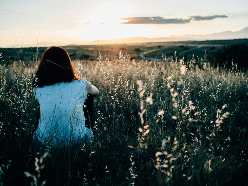 A woman relaxing in a field