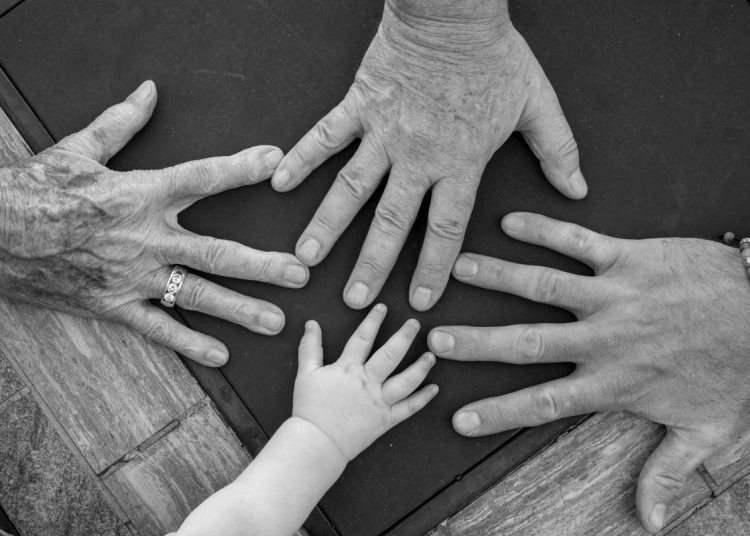 Four hands from different generations