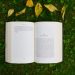 An open book on the grass