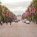 The Mall in London full of people and flags