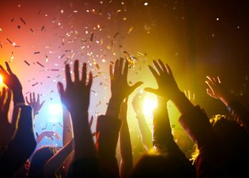 Raised hands at a music event