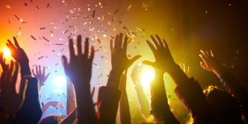 Raised hands at a music event