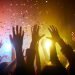 Raised hands at a music event